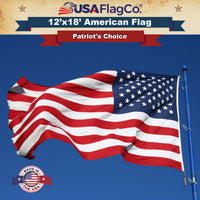 Premium 12x18 ft Nylon American Flag flying majestically outdoors.