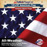 Close-up of densely embroidered white stars on the blue field of a premium US flag.